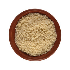 Small terracotta bowl filled with white bread crumbs isolated on a white background top view.