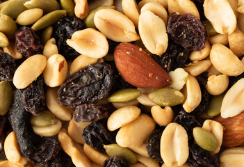 Assortment of nuts and dried fruit close view.