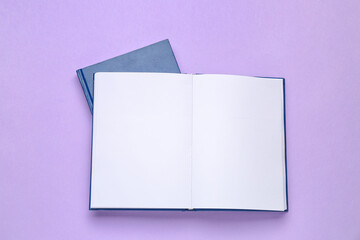 Blank books on color background