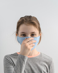 How to NOT wear a face covering or mask. Attractive fair-haired teenage girl wears protective face...