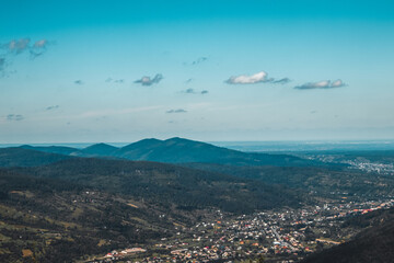 Summer landscape in mountains and the dark blue sky with clouds