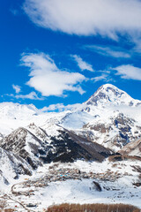 Kazbegi Mountain Winter View with Blue Sky