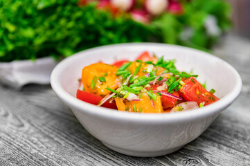 Fresh rustic vegetable salad on rustic background