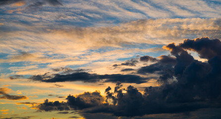 Beautiful sunset. Orange and black clouds in the sky