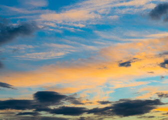 Beautiful sunset. Orange and black clouds in the sky