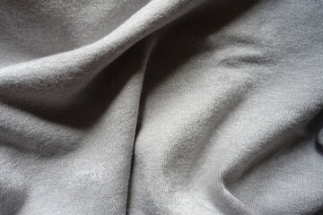 Crumpled simple gray jersey cotton fabric from above