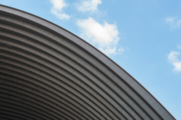 Fototapeta na wymiar Beautiful curved roof against the sky background
