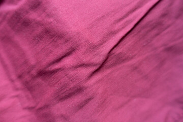 Fototapeta na wymiar Close view of jammed reddish rose viscose fabric