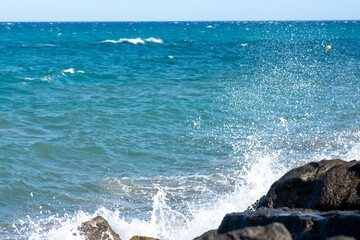 waves crashing on rocks