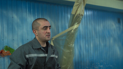 Portrait of male worker of Caucasian nationality close-up.