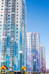 Fototapeta na wymiar windows on colorful building, new building, residential area 