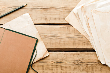 Vintage paper. Old notepad on a wooden background. Copy space