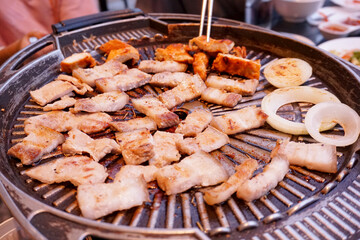 Selective focused, Samgyeopsal or Korean BBQ , pork belly on grilling pan