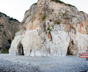 A massive rock spur of the mountain ridge that downgrades to the coast and ending on a beach. The...