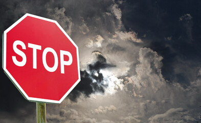 Conceptual stop sign with stormy background. Danger sign