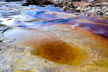 Rio Tinto riverbed in the old mines with colorful iron and copper deposits