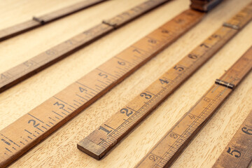 Group of Old wooden ruler on table. Measuring or accuracy concept