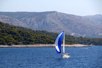 Sailing boat near island in Croatia. Beautiful Mediterranean landscape.