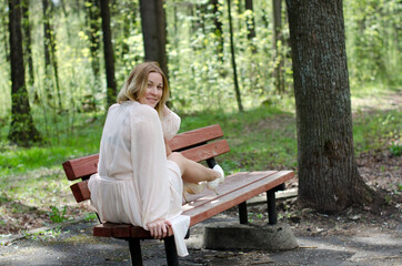 young girl in a dress in the park