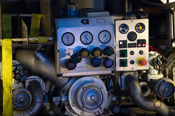 Firetruck pumping and valve control panel, firefighter car equipment of emergency vehicle, rescue service. Water pump controls details.
Translation: ''High pressure''