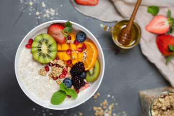 Close up two glasses of chia pudding decorated with fresh baby figs with spoon on table with copy space. Healthy food healthy lifestyle concept. High quality photo