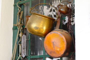 Old copper cookware in the interior of the house 