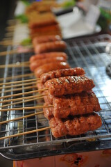 Moo Ping (Thai-style Grilled pork skewers).  It is is one of the favorite Thai street foods.