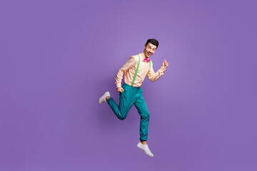 Fototapeta na wymiar Full length profile side photo of excited fast man jump run sale hurry isolated on purple color background