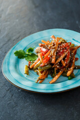 Delicious European lunch on a beautiful plate on a dark background. Nutritious Vegetable Food