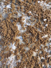 road poured by excessive amount of sand, snow