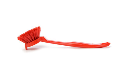 red plastic brush with handle for cleaning isolated on white background