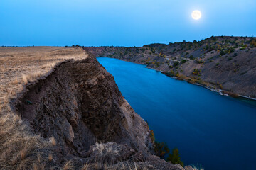 The moon illuminates the quarry lake