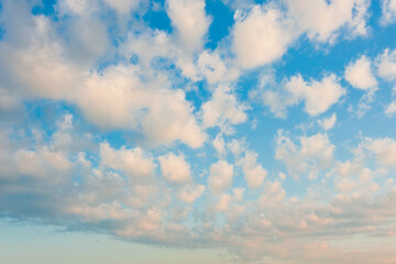 Beautiful summer sunrise, clouds in the blue sky