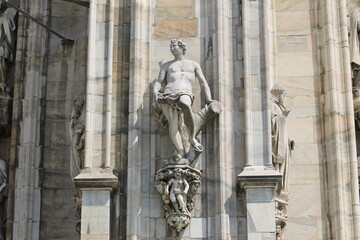 Fototapeta premium Detail of a sculpture on the facade of the Milan Cathedral, Italy