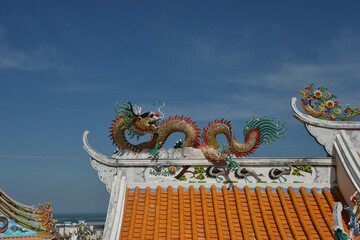 Beautiful Dragon Sculpture on The Roof in Wihan Thep Sathit Phra Kitthi Chalerm Shrine (Nacha Sa Thai Chue Shrine or Naja Shrine) Bang Sean, Chonburi, Thailand