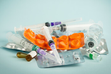 Empty medication blisters, used syringes and ampoules