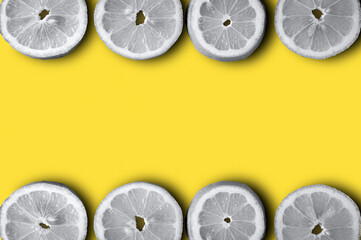 background with lemon slices on a trendy yellow background