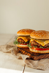 burgers on wooden background 