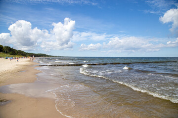 The lonely beach with waves and sun on the island of Usedom.