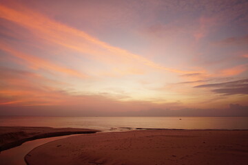 Nature image Landscape view of sunset over beach. Twilight sky red background.
