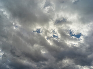 Texture of a blue sky with gray and dark clouds