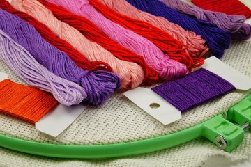 Multicolored embroidery threads and embroidery hoops