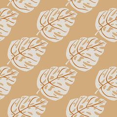 Pastel tones seamless pattern with grey colored monstera shapes. Beige background. Exotic foliage backdrop.