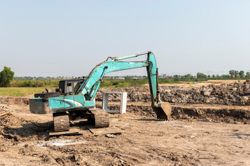 Obraz premium Backhoes are digging in the construction site 
