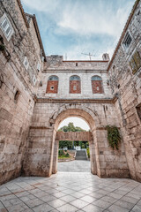 Fototapeta na wymiar Stone facade of golden gate entrance to Diocletian Palace in Split Croatia