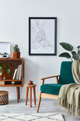 Stylish interior of living room with design wooden shelf, velvet sofa,  plants, mock up poster map,...