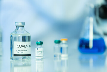 Bottle of COVOD-19 vaccine sample in a laboratory. Idea for researching and lab tests for coronavirus curing