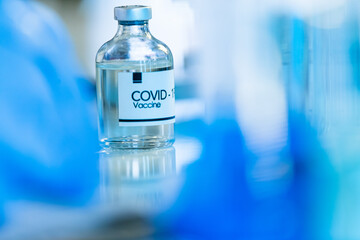 Bottle of COVOD-19 vaccine sample in a laboratory. Idea for researching and lab tests for coronavirus curing