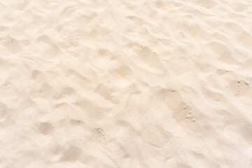 Naklejka na ściany i meble Pattern of sand texture at the beach in summer