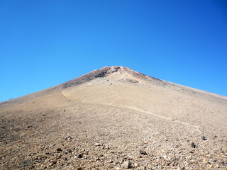 Fototapeta na wymiar Top of the Teide volcano on the Canary island Tenerife against the blue sky